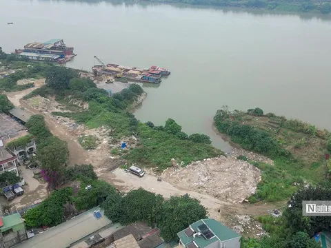 Hà Nội yêu cầu cưỡng chế các bãi chứa vật liệu xây dựng ven sông