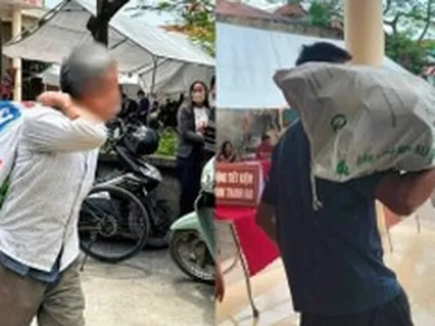 Người dân vác bao tải đi đựng tiền đền bù đất siêu dự án Olympic